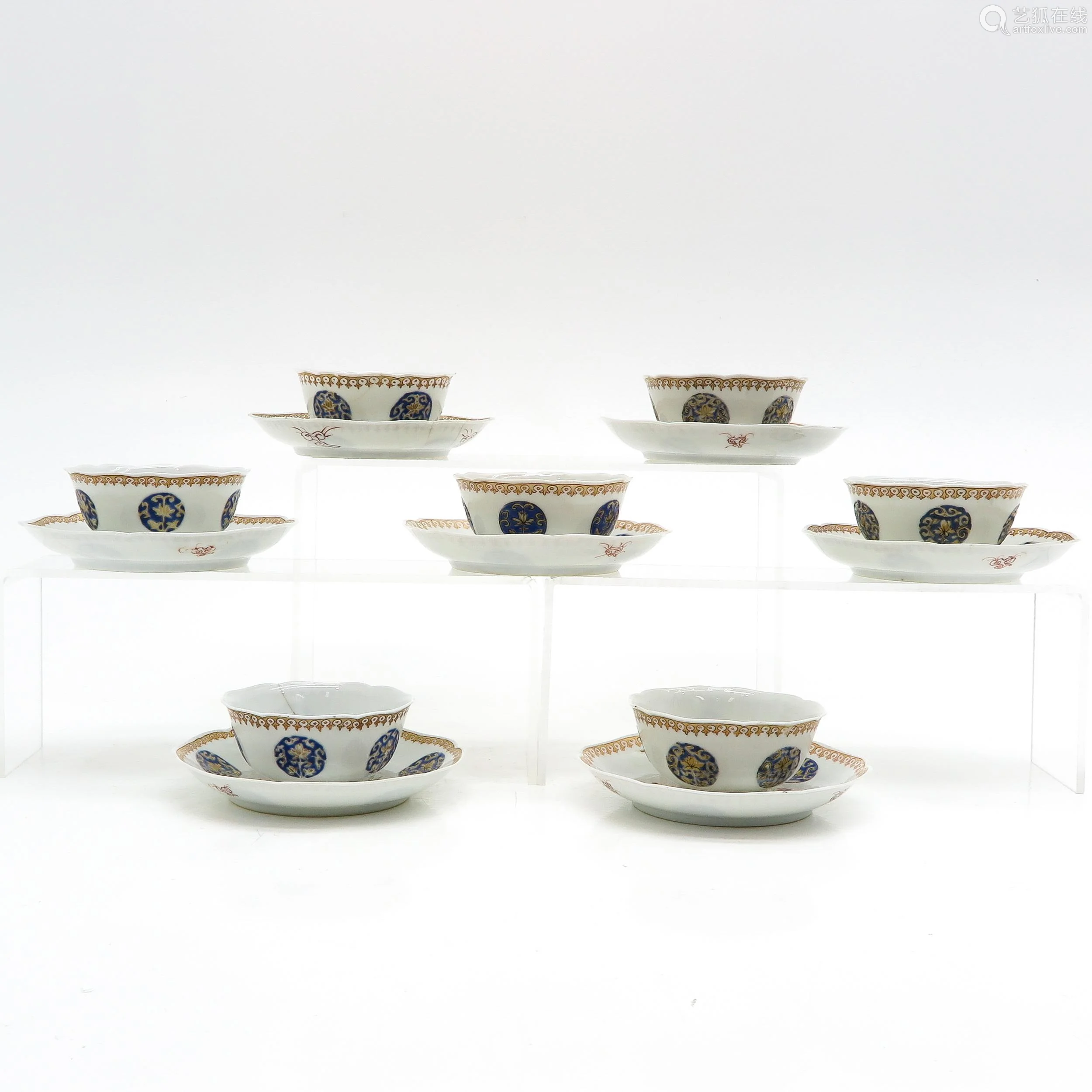 a collection of cups and saucers