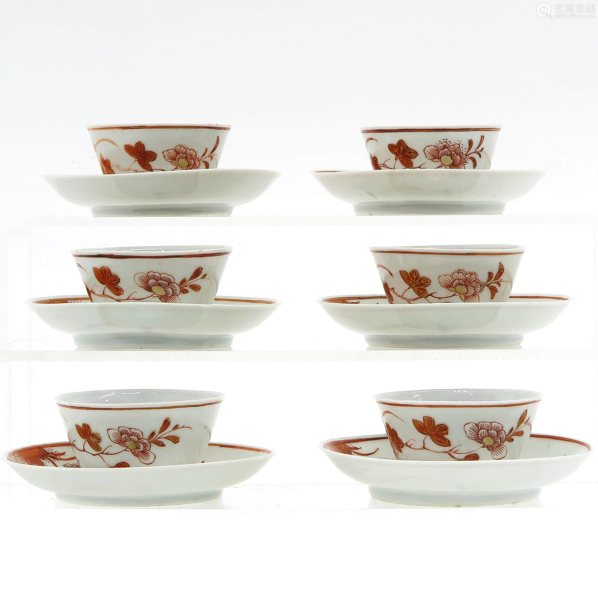 a collection of cups and saucers