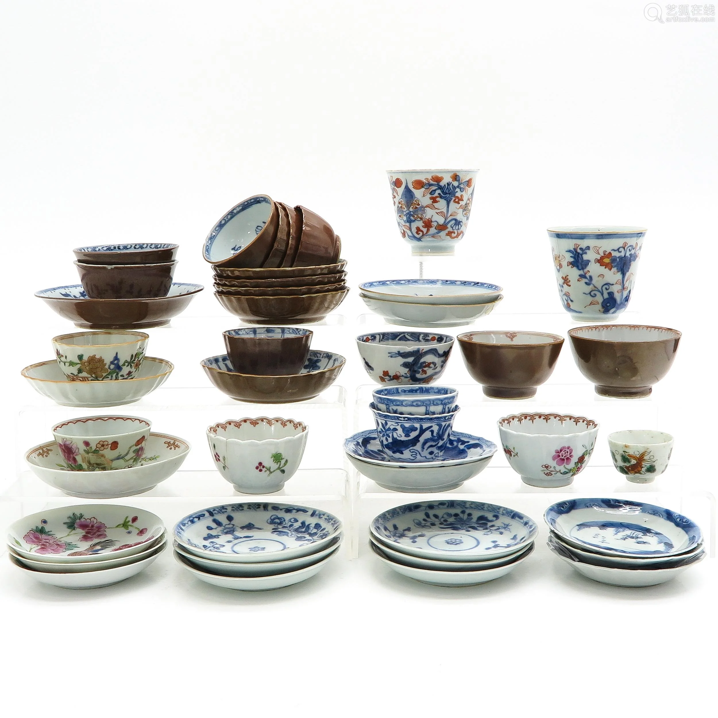 a collection of cups and saucers
