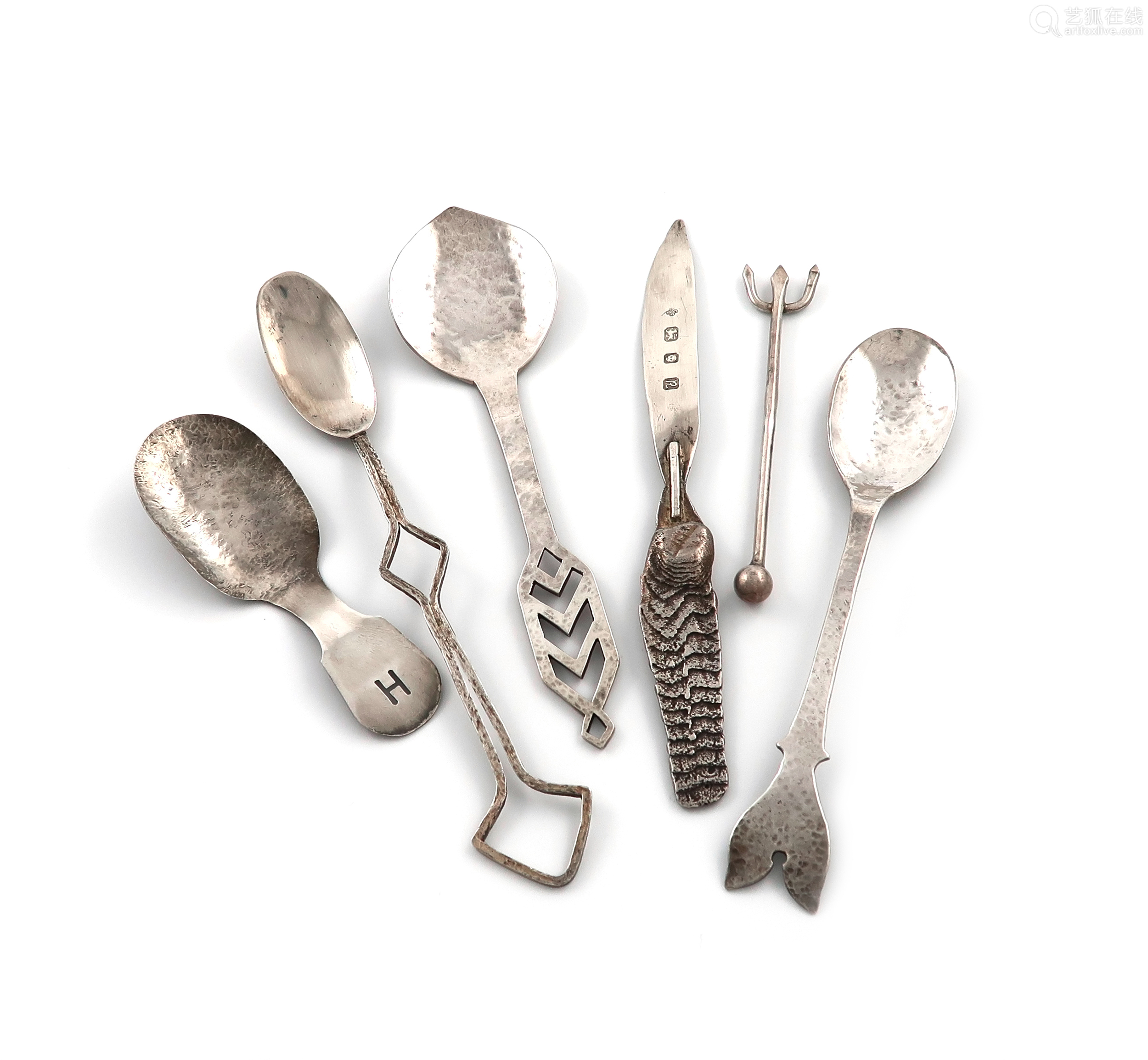 collection of modern silver flatware, comprising: a pickle fork