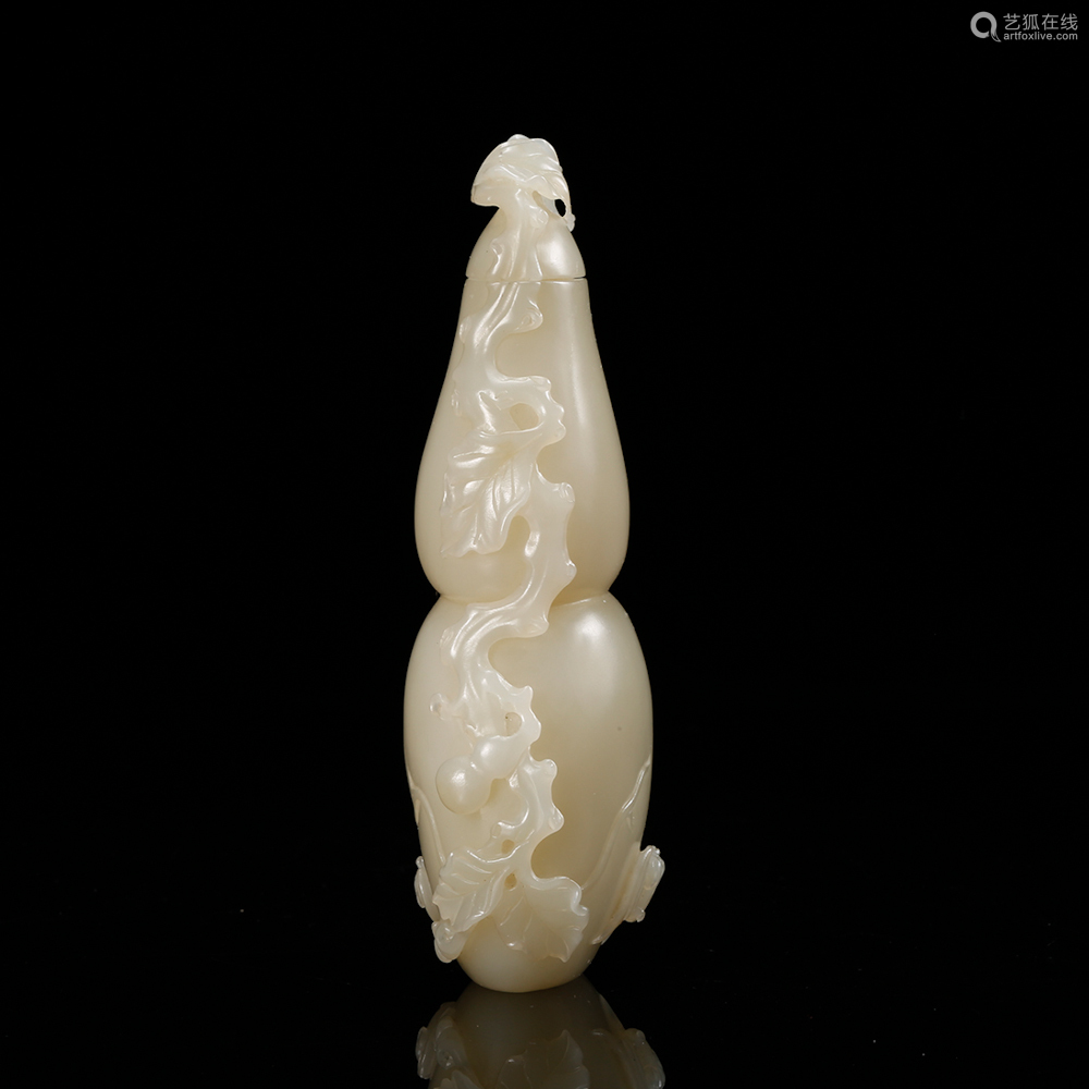 a white jade carved gourd