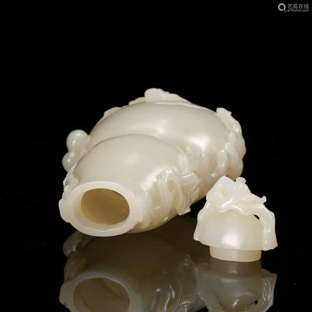 a white jade carved gourd