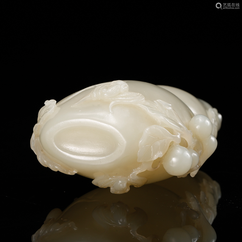 a white jade carved gourd