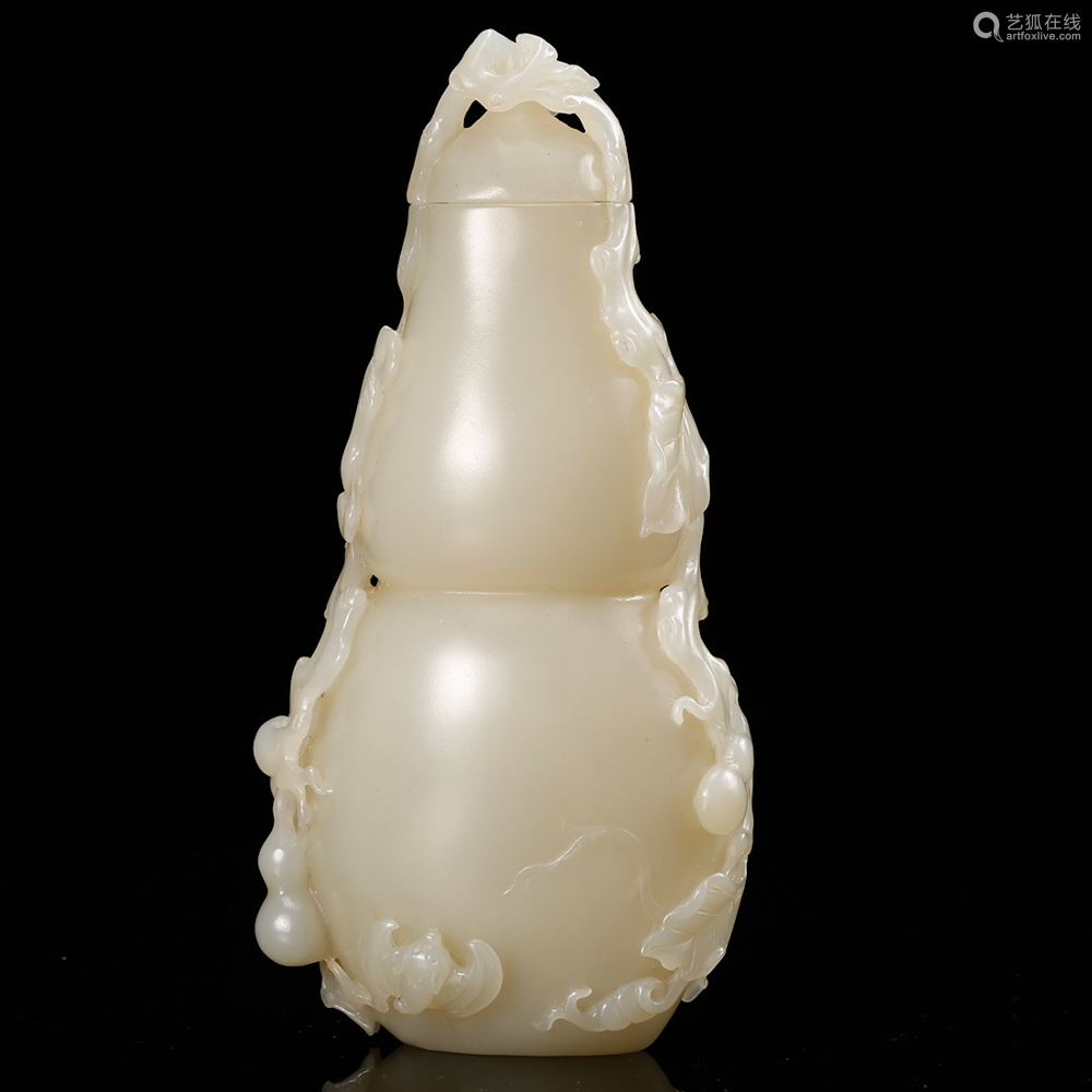 a white jade carved gourd