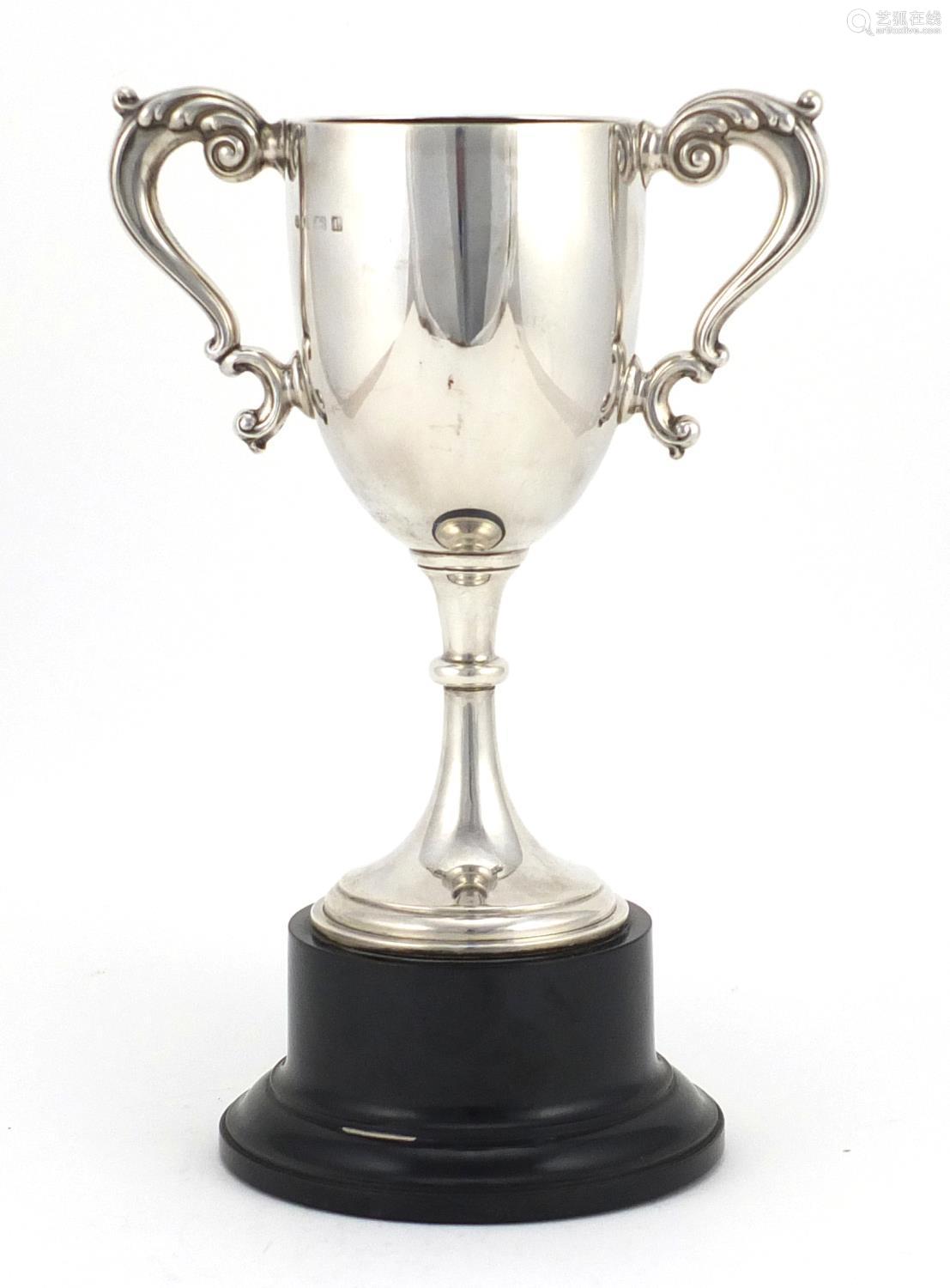 silver twin handled trophy on stand, by william neale & son ltd