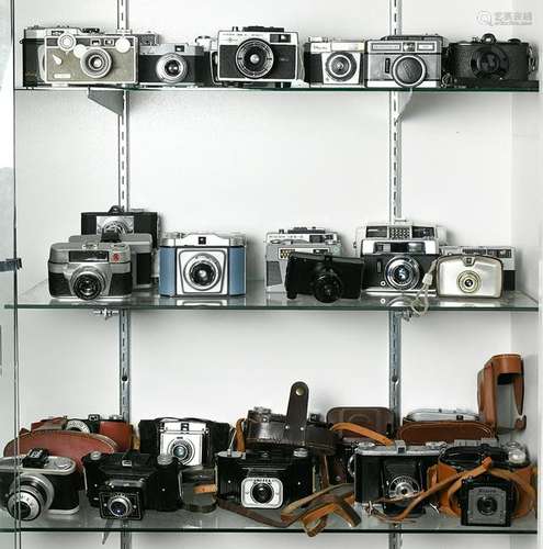 Four shelves of vintage metal veiwfinder cameras and