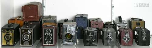 One shelf of antique color box cameras