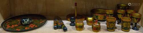 One shelf of Russian lacquer tableware including egg