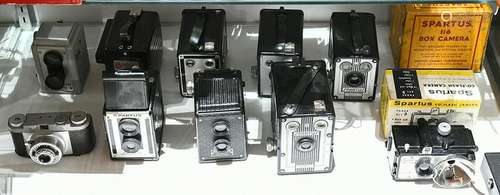 One shelf of Spartus cameras