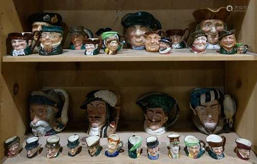 Two shelves of Royal Doulton character jugs