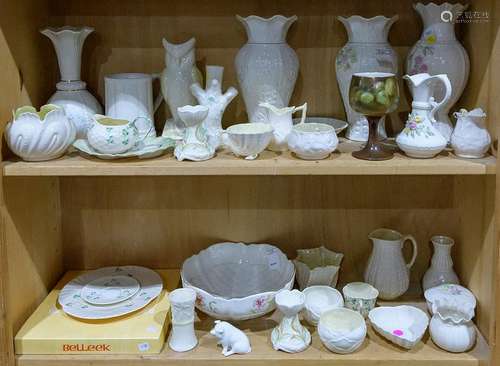 Two shelves of mostly Belleek table articles including