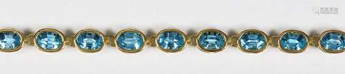 Blue topaz, 14k yellow gold bracelet