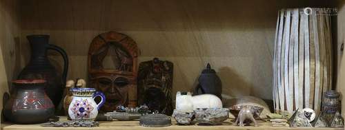 Two shelves of decorative art including Native American