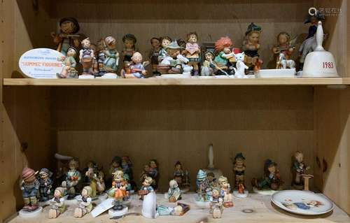 Two shelves of mostly Hummels including Playmates,