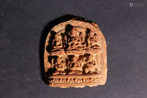 A Chinese Carved Clay Buddha Pendant
