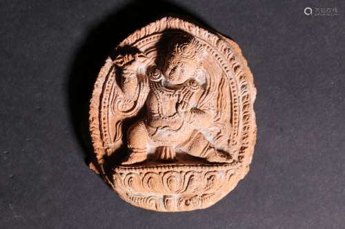 A Chinese Carved Clay Buddha Pendant