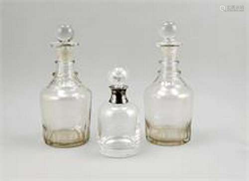 Three carafes, 20th cent., 2x brownish, 1x clear glass,