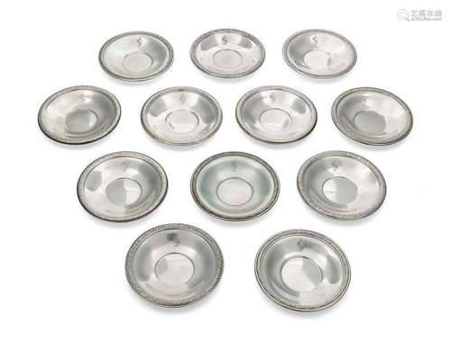 A Set of 12 Silver Butter Pats Diameter each 3