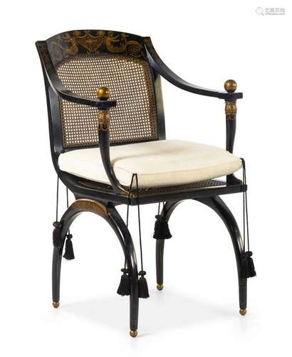 An Italianate Parcel Gilt and Ebonized Armchair