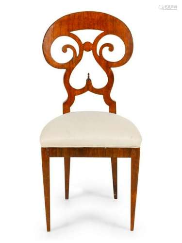 A Biedermeier Walnut Side Chair having a round