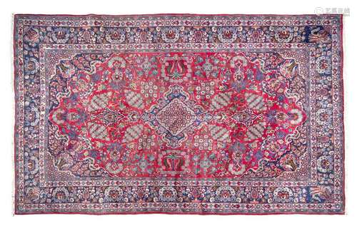 A Persian Room Sized Wool Rug 14 Feet 2 inches