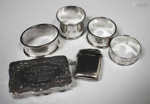 A late Victorian silver shaped rectangular snuff box with engraved presentation inscription and