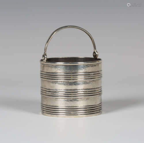 A George II silver cream pail with swing handle, the cylindrical body with horizontal ribbed