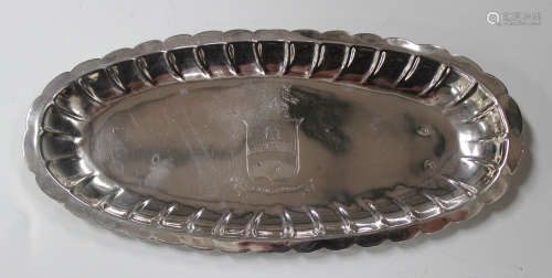 An 18th century Irish silver oval snuffer tray with raised reeded and petal rim, the centre with