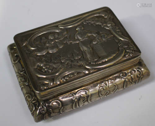 A late 19th century Continental silver rectangular cushion shaped snuff box, the hinged lid and
