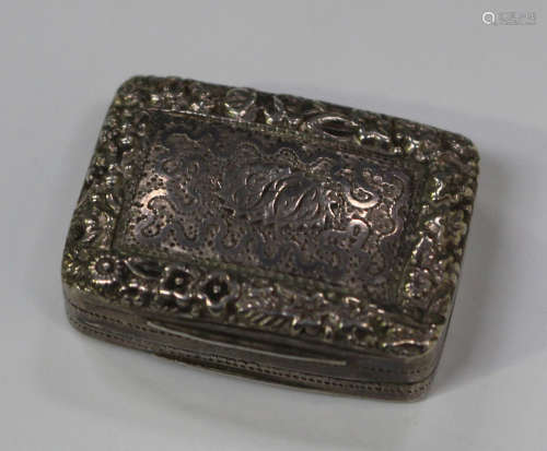 A George III silver rectangular vinaigrette with raised foliate rim, the hinged lid revealing an