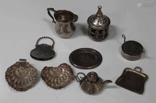 A group of Continental silver miniature items, including a jug, an oval plate, a purse and a crumb