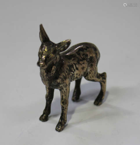 A George V silver model of a young deer, modelled in a standing pose, import mark Chester 1911 by