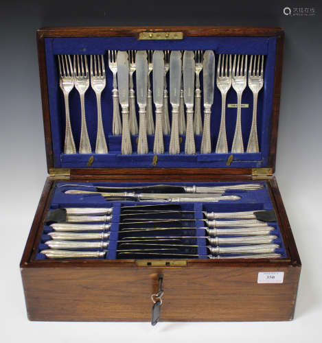 A George V silver Old English bead pattern canteen of cutlery, comprising six table knives, forks