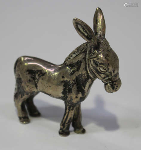 An Edwardian silver model of a standing donkey, import mark Chester 1902 by Berthold Muller,