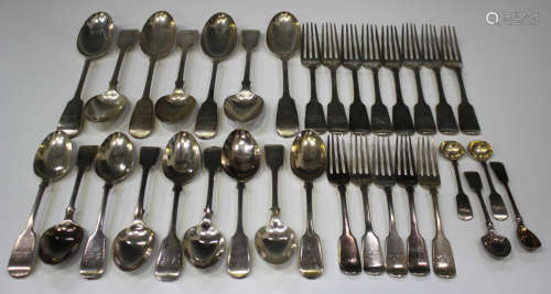 A Victorian part canteen of silver Fiddle pattern cutlery, comprising seven tablespoons, eight table