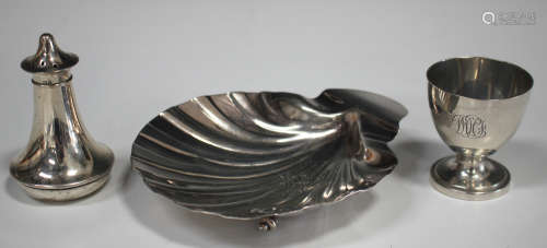A Victorian silver butter shell, raised on three shell feet, London 1887 by Francis Higgins & Sons