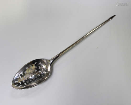 A George III silver mote spoon with tapering handle and pyramid terminal, the bowl pierced with
