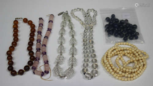 A single row necklace of amethyst and carved rose quartz beads, length 39cm, a single row necklace