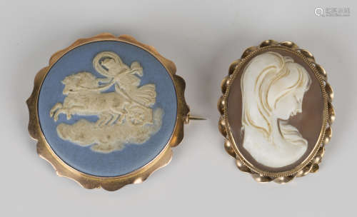 A gold mounted Wedgwood jasperware circular brooch, designed as a chariot scene, detailed 'Wedgwood'