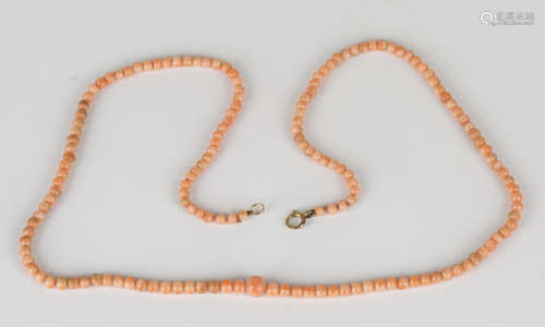 A single row necklace of graduated coral beads on a boltring clasp, length 46.5cm.Buyer’s Premium