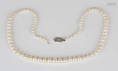 A single row necklace of graduated cultured pearls on a diamond set rectangular clasp, length