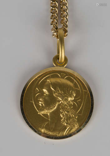 A gold devotional pendant, the obverse depicting a portrait of Christ, detailed '750', length 2.5cm,