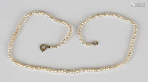 A single row necklace of seed pearls on a boltring clasp, length 34cm.Buyer’s Premium 29.4% (