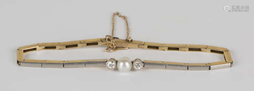 A gold and platinum bracelet in a bar link design, the front mounted with a cultured pearl between