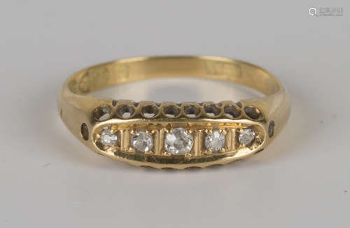 An 18ct gold and diamond five stone ring, mounted with a row of cushion shaped diamonds, Chester