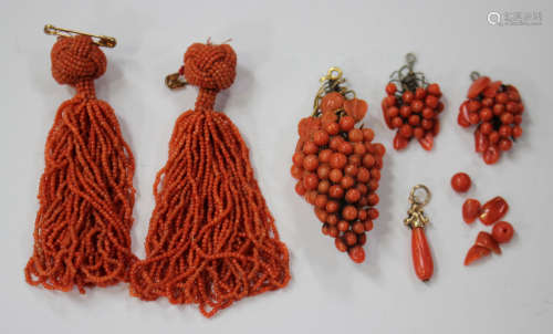 A group of coral jewellery, comprising a pair of pendant tassels, length 7cm, a brooch, designed