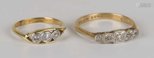 A gold, platinum and diamond three stone ring, mounted with circular cut diamonds in an openwork