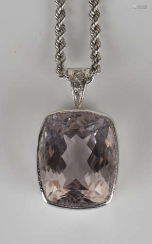 A 9ct white gold, morganite and diamond pendant, collet set with a rectangular cushion shaped pink