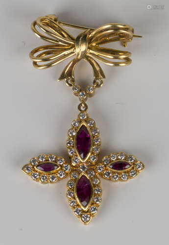 An 18ct gold, ruby and diamond brooch, the pendant drop mounted with four marquise shaped rubies,