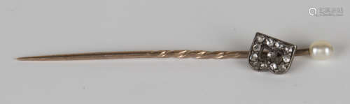 A Victorian rose cut diamond and seed pearl stickpin, designed as the initial 'B'.Buyer’s Premium